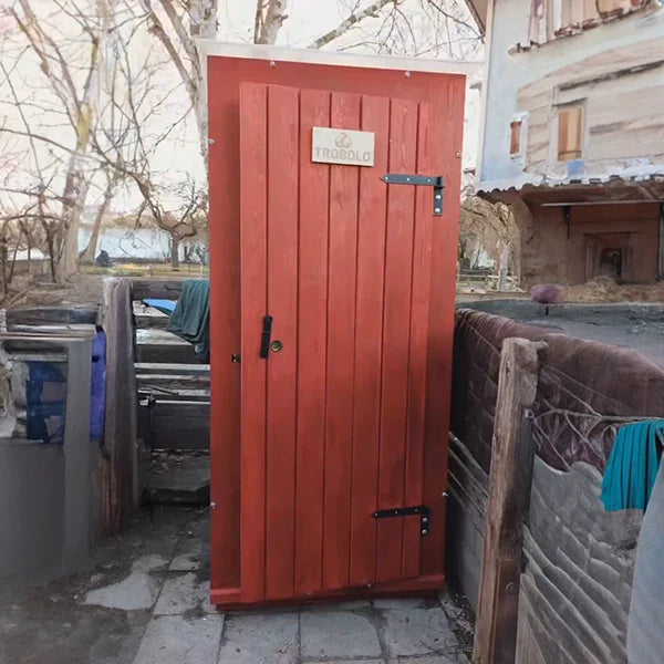 TROBOLO KitaBoem composting toilet red paint outside