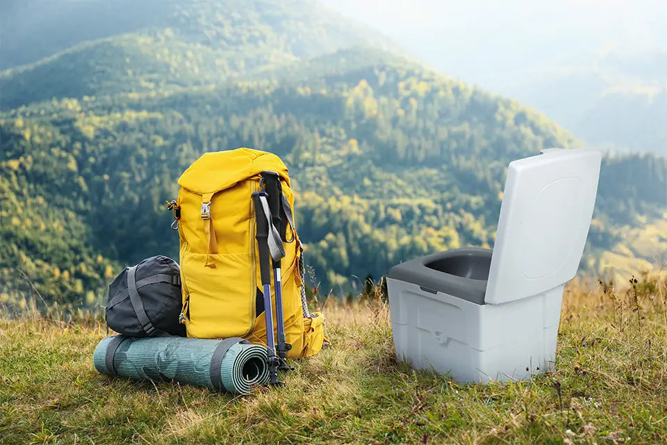 TROBOLO WandaGO Lite on a hill in nature next to a yellow backpack